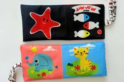 آویز کتاب پارچه ای نوزادی جغجغه ای